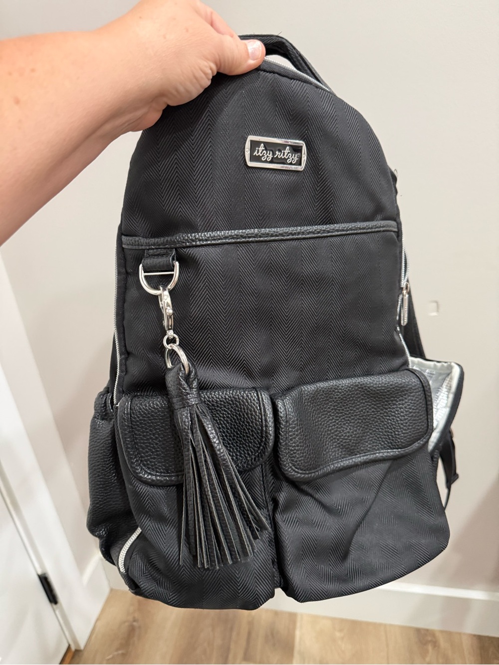 Itzy Ritzy Black Convertible Tassel Backpack